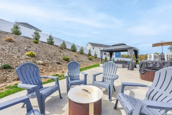 a view of a patio with table and chairs