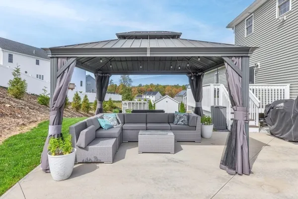 a view of living room filled with furniture and a porch