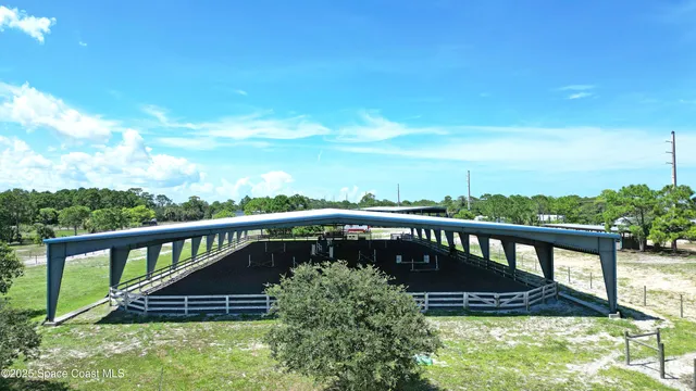 a view of a roof deck with wooden floor and fence
