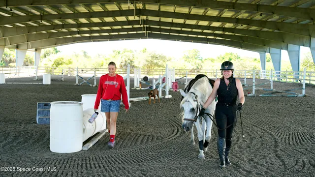 a view of a porch with a table and chairs