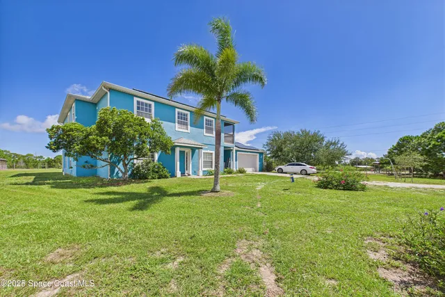 a house view with a garden space