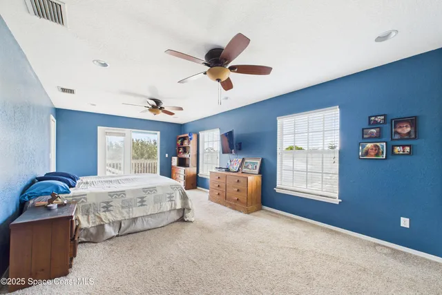 a bedroom with bed and window