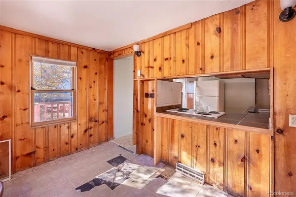 a livingroom with furniture and a window