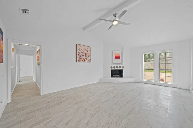 a view of an empty room with a window