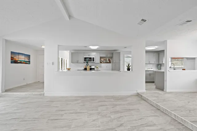 a view of kitchen and wooden floor