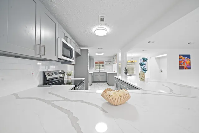 a kitchen with furniture and a view of kitchen