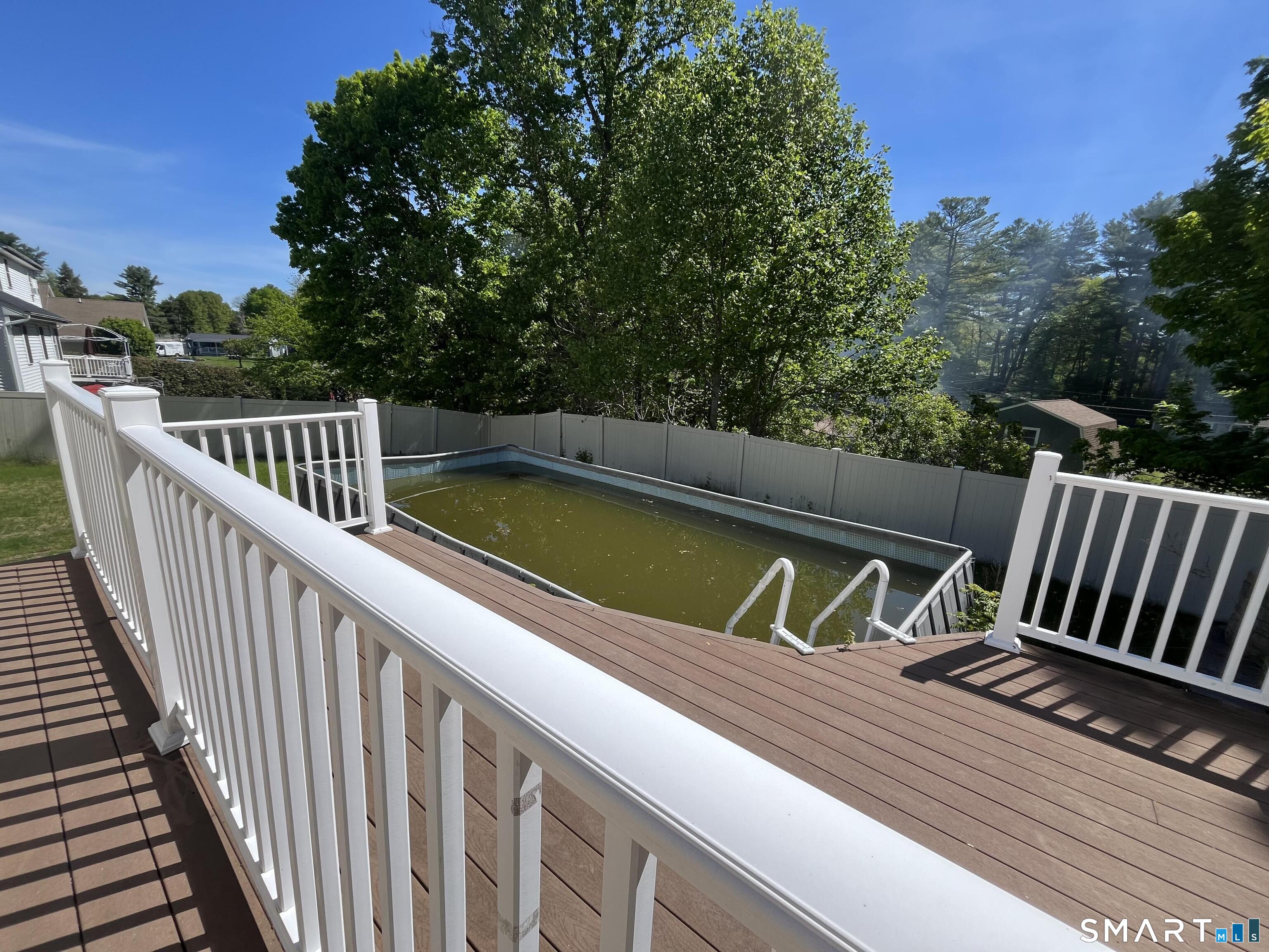 52 Monce Road Burlington, CT 06013 - Photo 25 of 26 a view of swimming pool with trees in the background