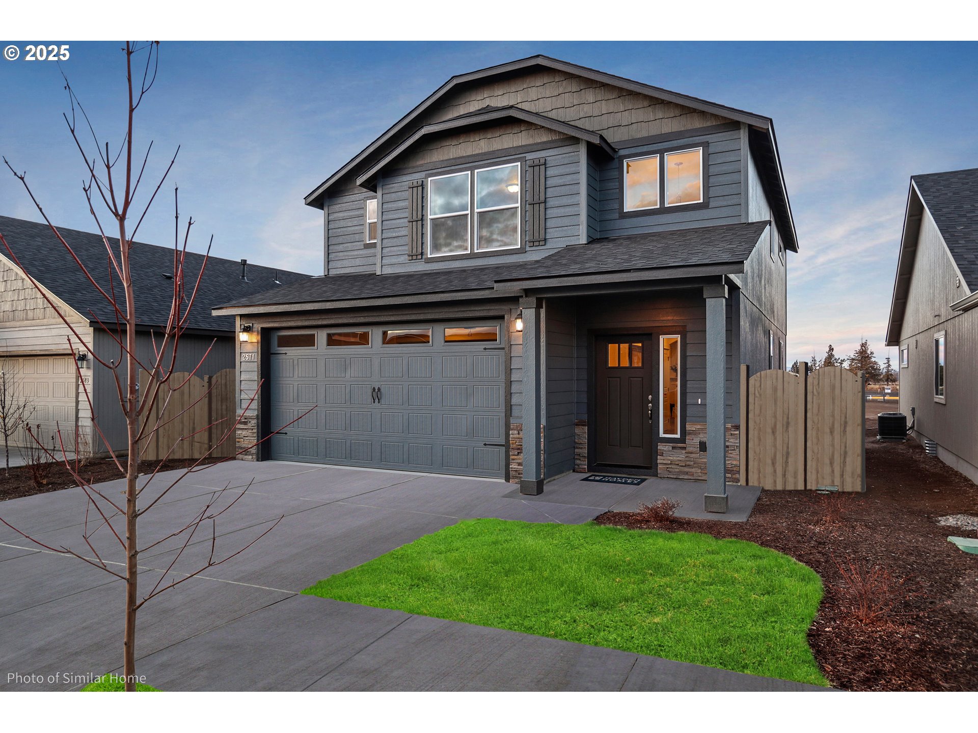 5103 Cedar View Drive Springfield, OR 97478 - Photo 1 of 7 a view of a house with a small yard and floor to ceiling window