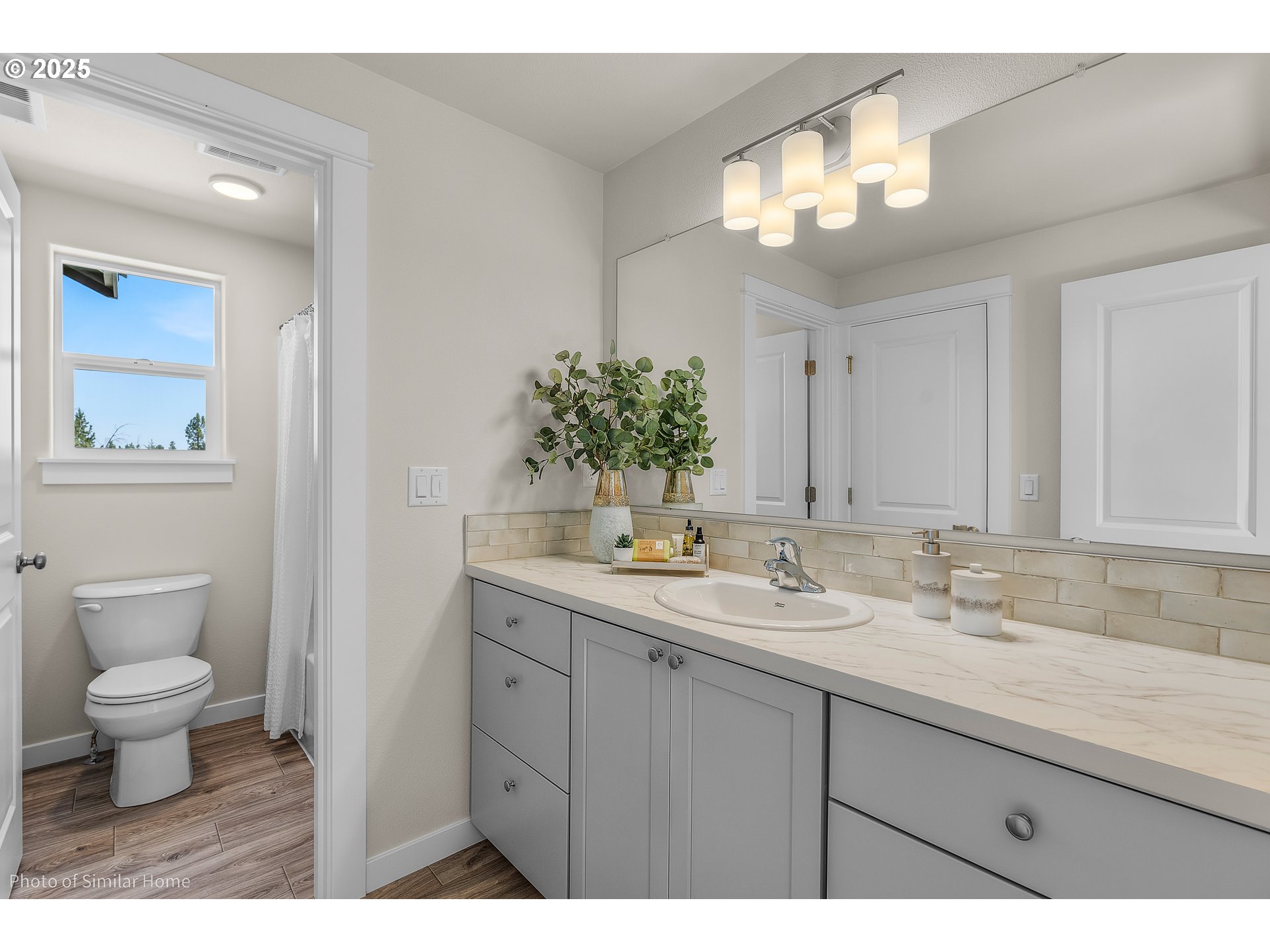 5103 Cedar View Drive Springfield, OR 97478 - Photo 7 of 7 a bathroom with a toilet sink and mirror