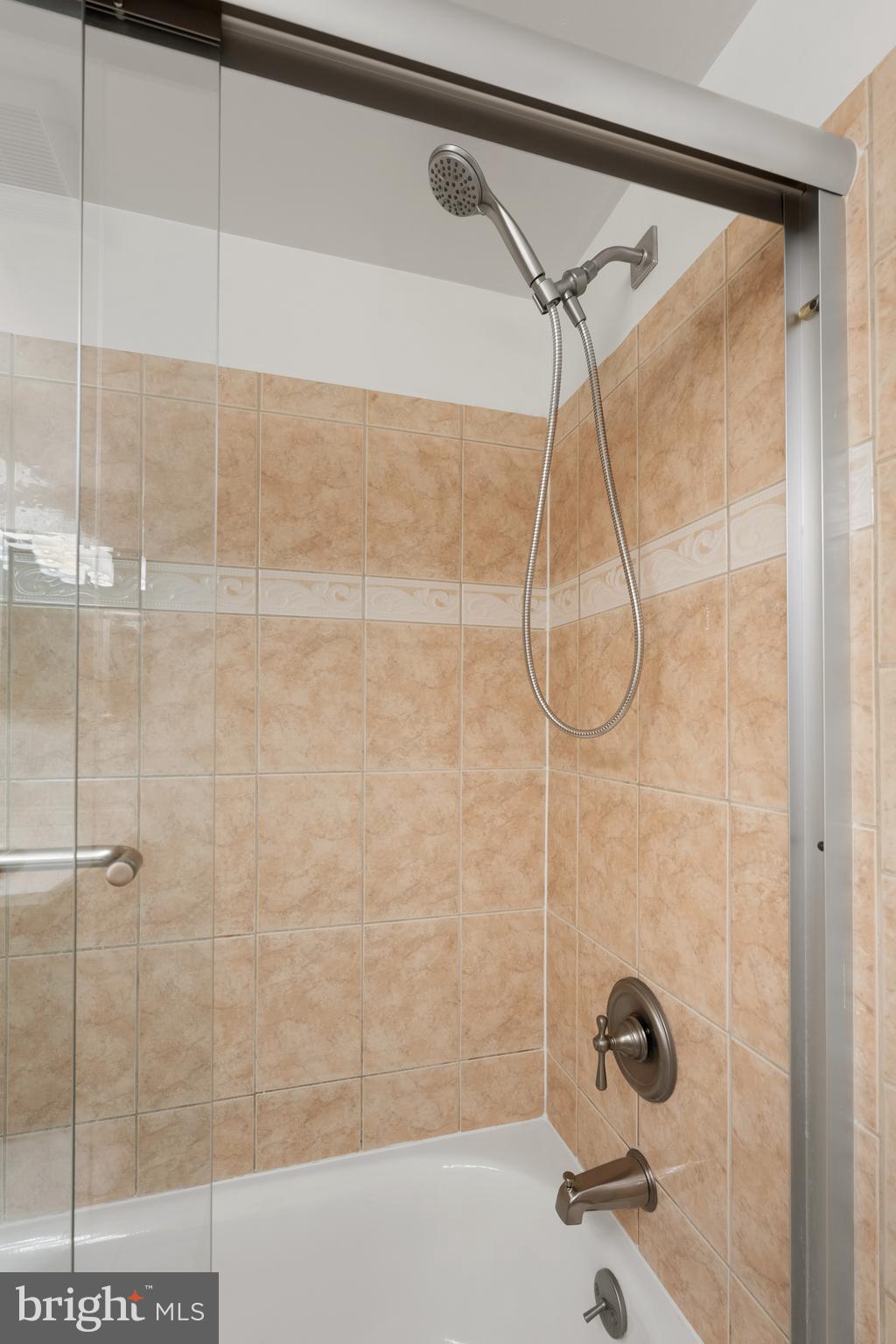 18715 Walkers Choice Road, Unit 18715 Montgomery Village, MD 20886 - Photo 19 of 30 a bathroom with a shower