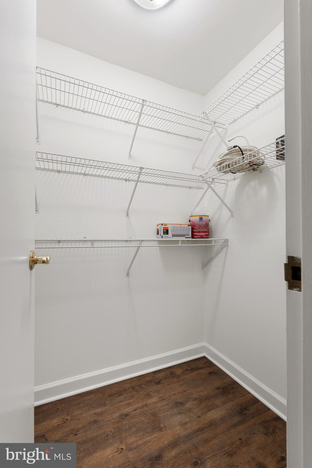 18715 Walkers Choice Road, Unit 18715 Montgomery Village, MD 20886 - Photo 24 of 30 a view of a room with racks on the wall