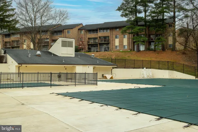 a view of a swimming pool with a patio