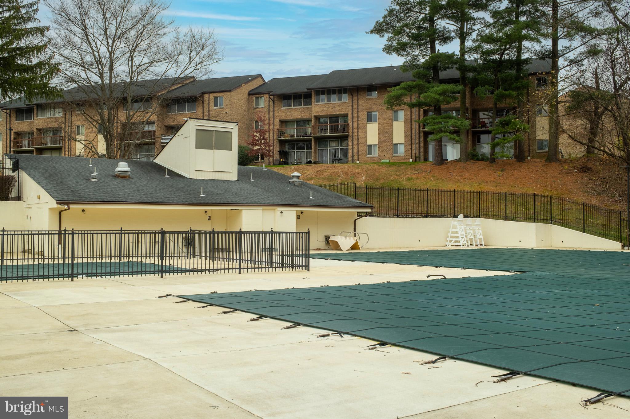 18715 Walkers Choice Road, Unit 18715 Montgomery Village, MD 20886 - Photo 25 of 30 a view of a swimming pool with a patio