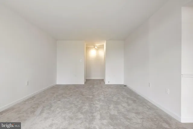 a view of an empty room with yellow lighting