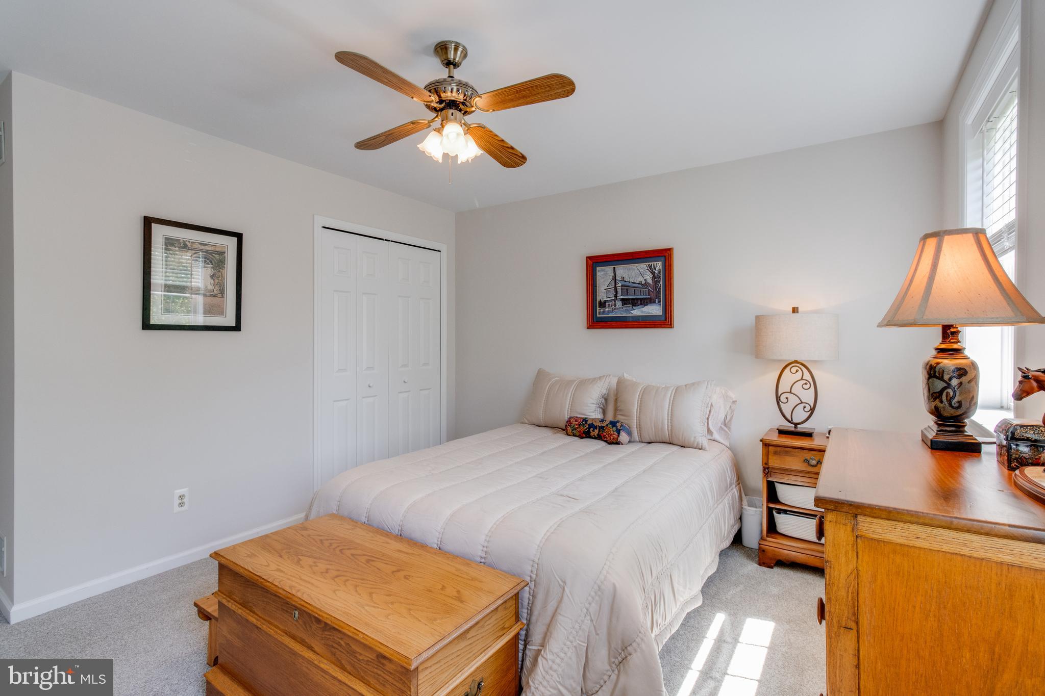 3888 Sterling Way Columbia, PA 17512 - Photo 22 of 44 a bedroom with a bed and a lamp on table