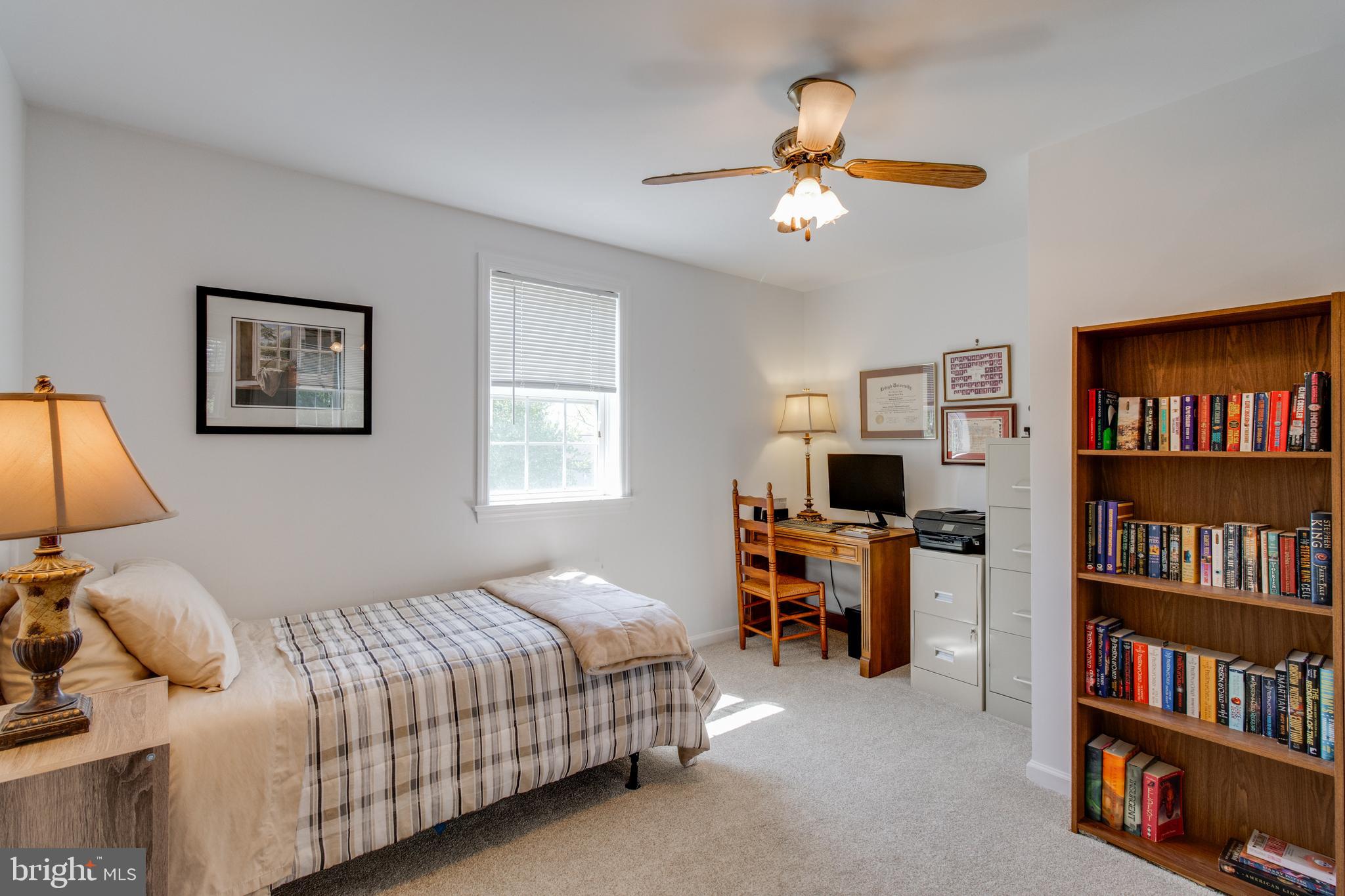 3888 Sterling Way Columbia, PA 17512 - Photo 25 of 44 a bedroom with a bed and a book shelf