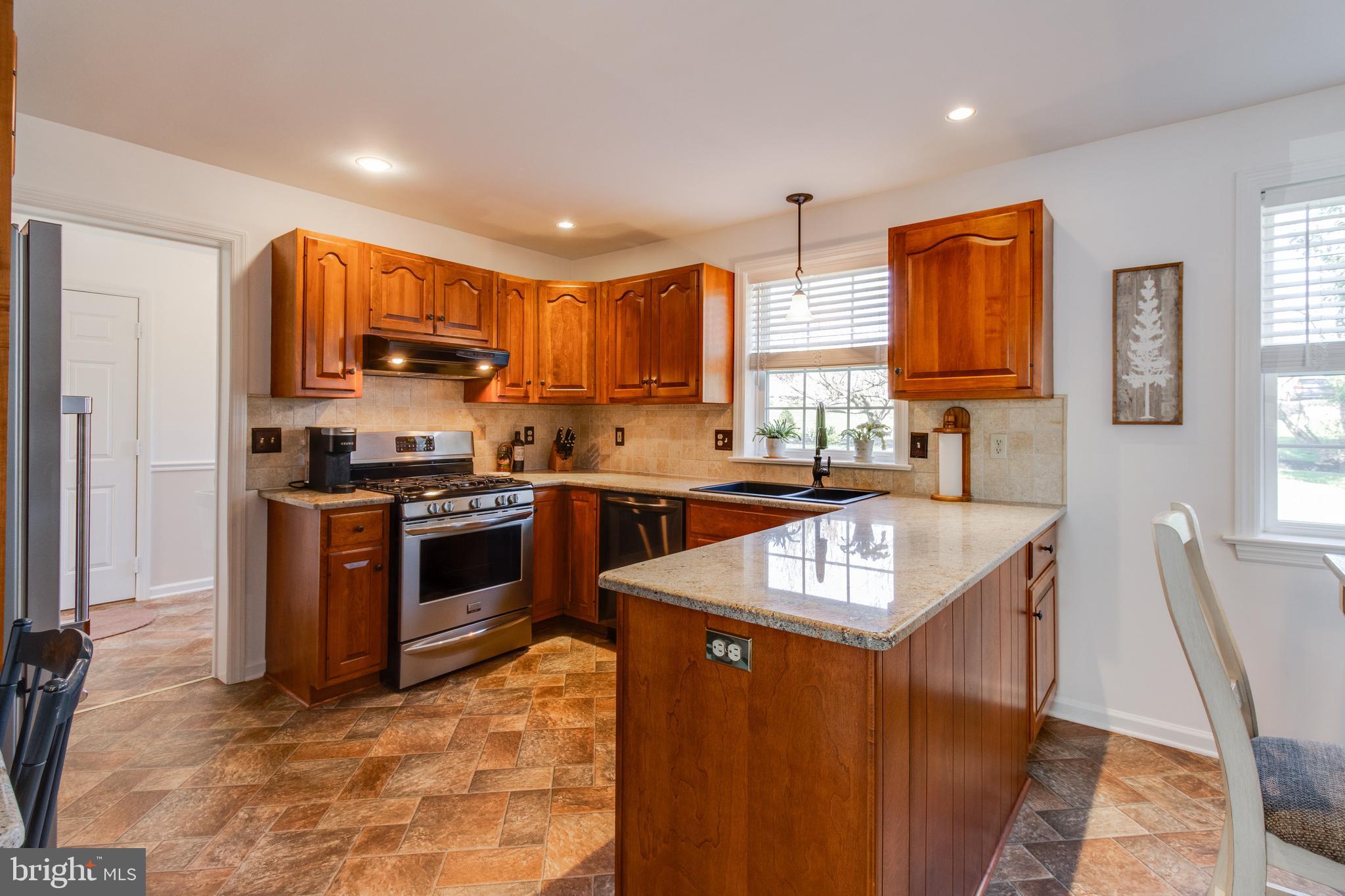 3888 Sterling Way Columbia, PA 17512 - Photo 6 of 44 a kitchen with stainless steel appliances granite countertop a stove sink and a refrigerator