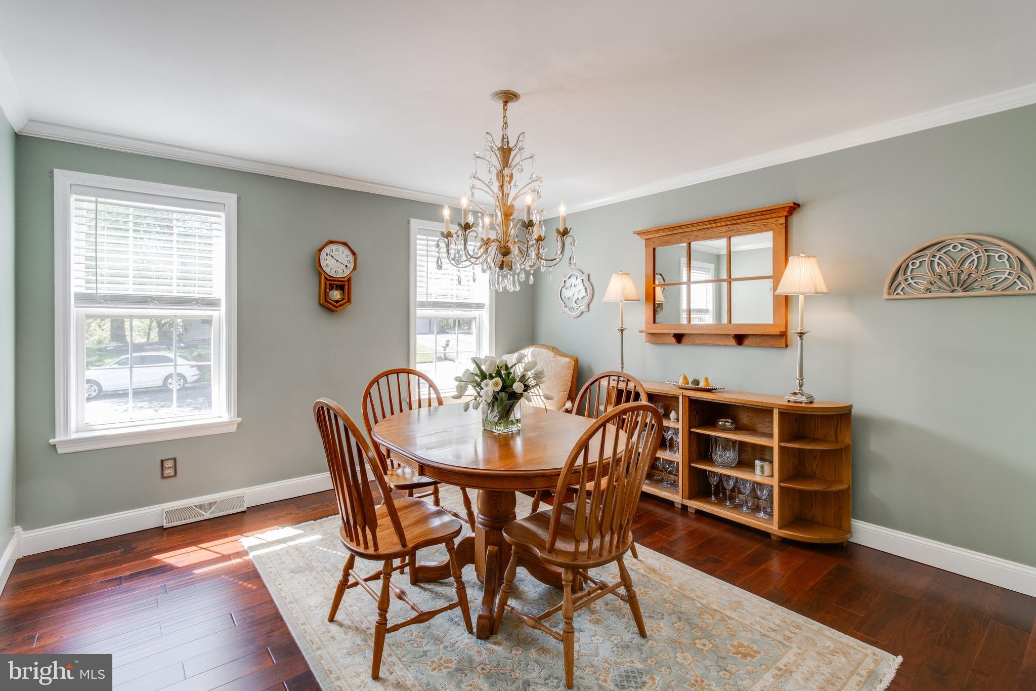3888 Sterling Way Columbia, PA 17512 - Photo 8 of 44 a dining room with furniture a chandelier and wooden floor