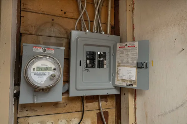 a bathroom with a granite countertop shower and a toilet