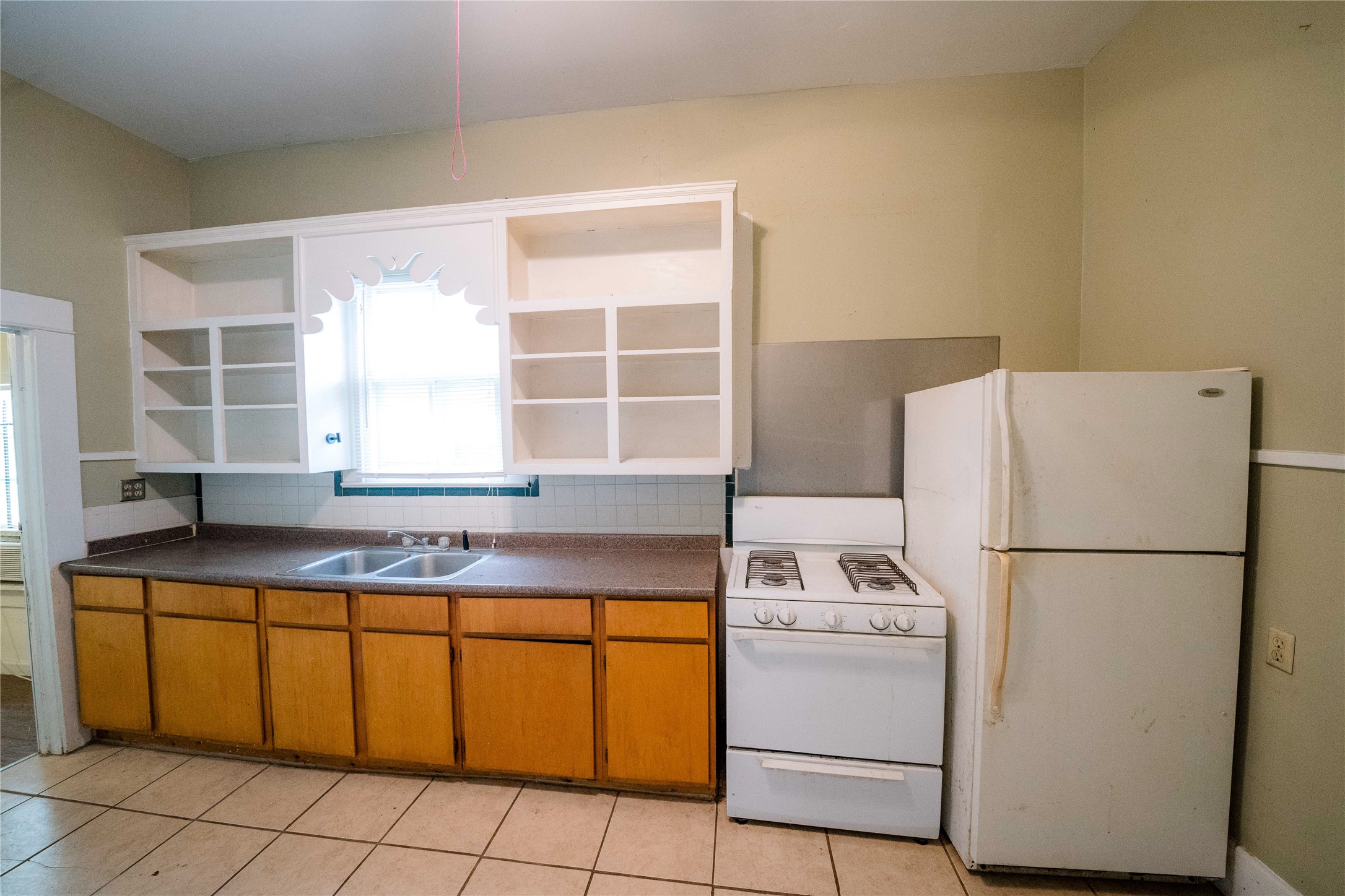 815 Quitman Street Houston, TX 77009 - Photo 20 of 26 a white refrigerator freezer sitting inside of a kitchen