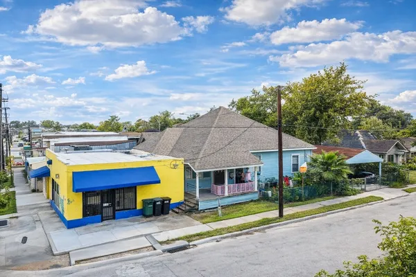 a view of a hallway with furniture and a window