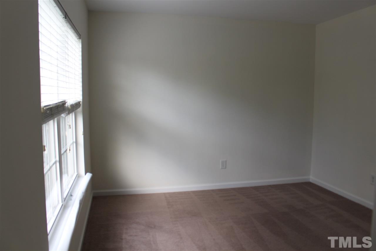 5321 Neuse Forest Road Raleigh, NC 27616 - Photo 11 of 25 an empty room with wooden floor and windows
