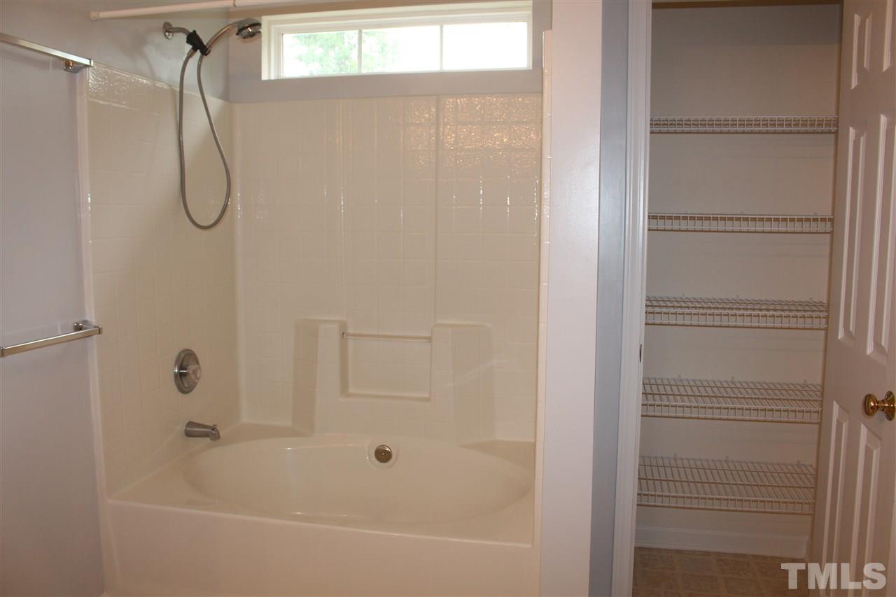 5321 Neuse Forest Road Raleigh, NC 27616 - Photo 12 of 25 a bathroom with a bath tub with a shower