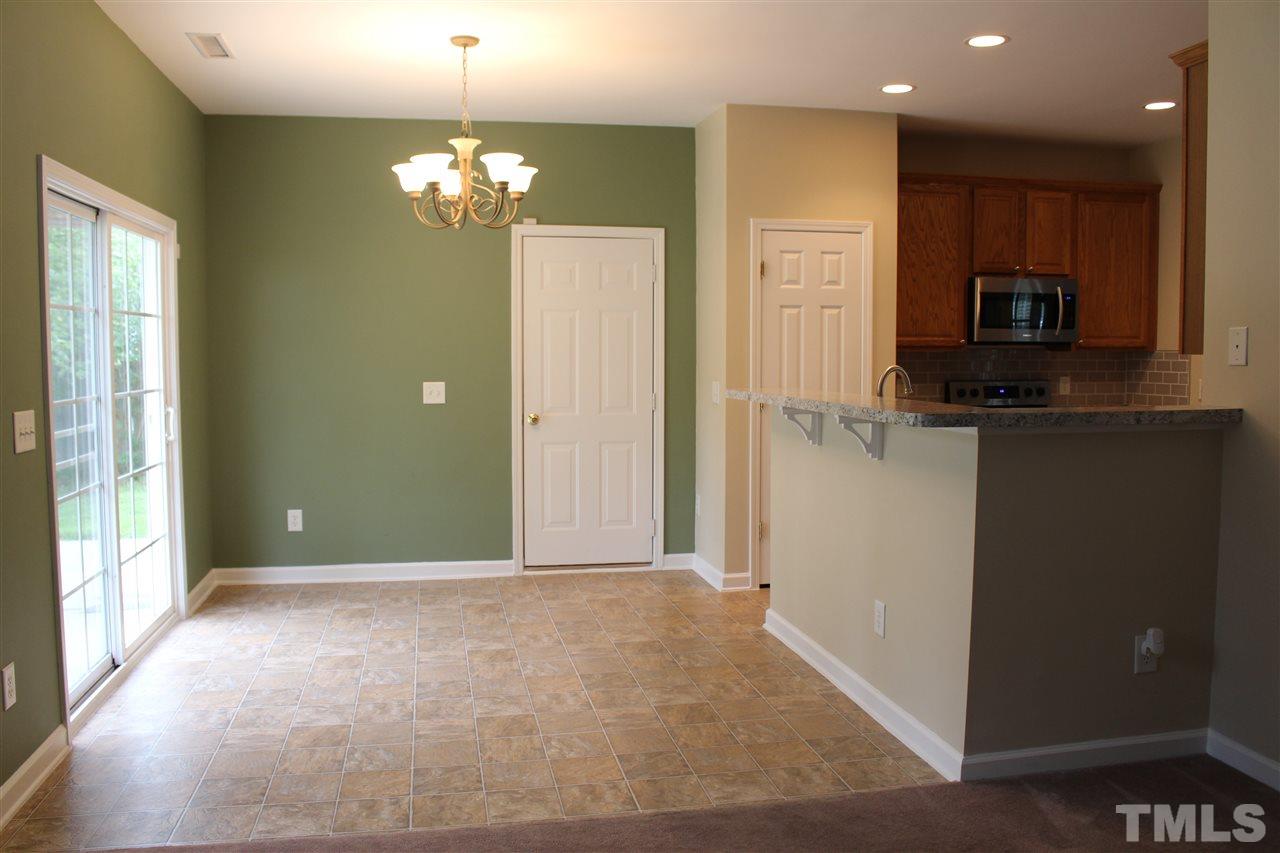 5321 Neuse Forest Road Raleigh, NC 27616 - Photo 22 of 25 a view of a kitchen with a sink and chandelier