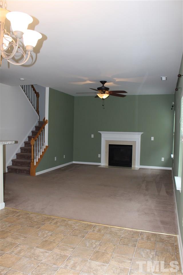 5321 Neuse Forest Road Raleigh, NC 27616 - Photo 5 of 25 a view of a livingroom with an empty space and a fireplace