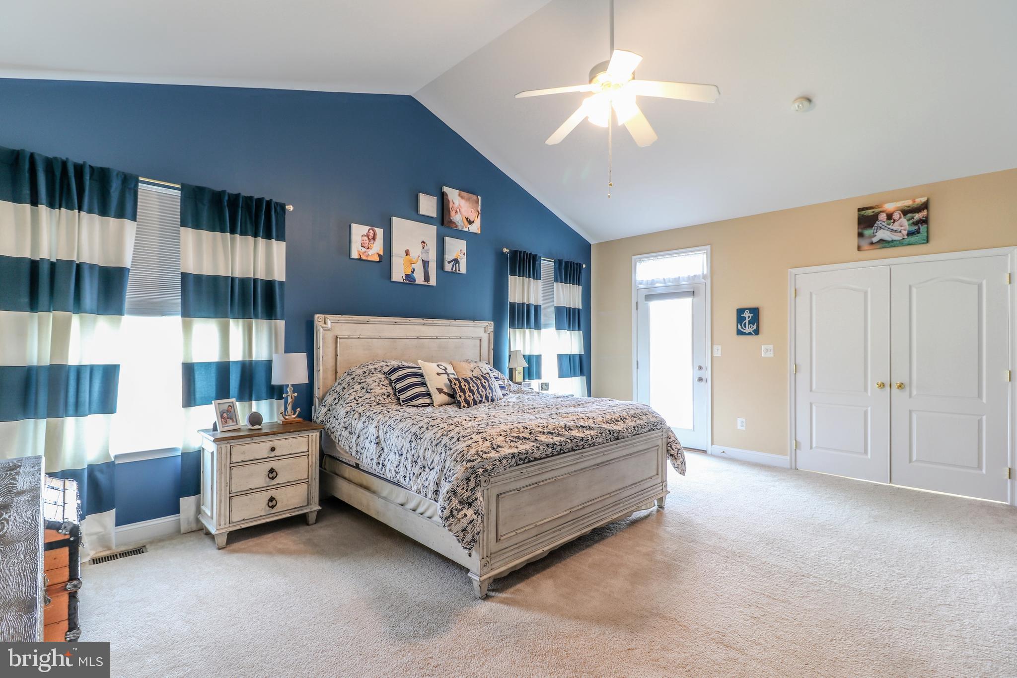 11151 Rawhide Road Lusby, MD 20657 - Photo 14 of 35 Large master bed with door to deck