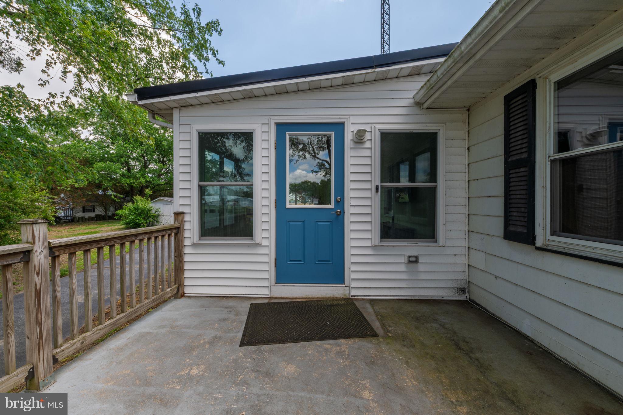 32517 Molly Field Road Dagsboro, DE 19939 - Photo 9 of 25 Charming entryway with vibrant blue door.