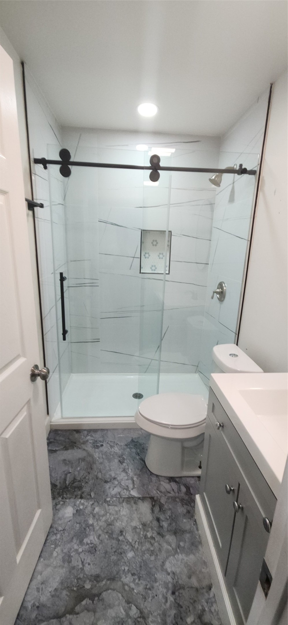 2304 Chapman Street, Unit 3 Houston, TX 77009 - Photo 14 of 17 a bathroom with a toilet a sink and a shower