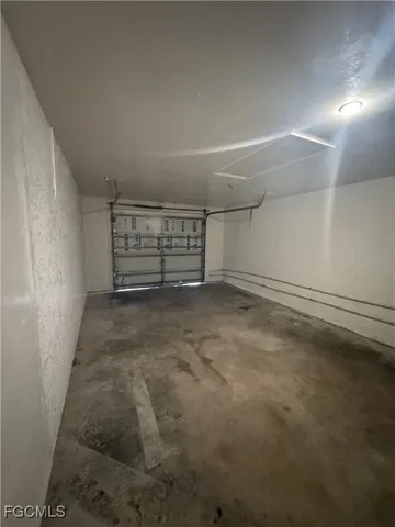 a view of an empty room with a fireplace