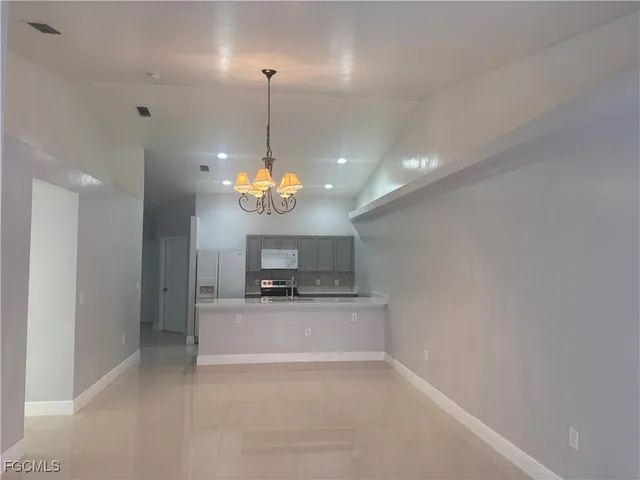a view of a kitchen with a sink and dishwasher