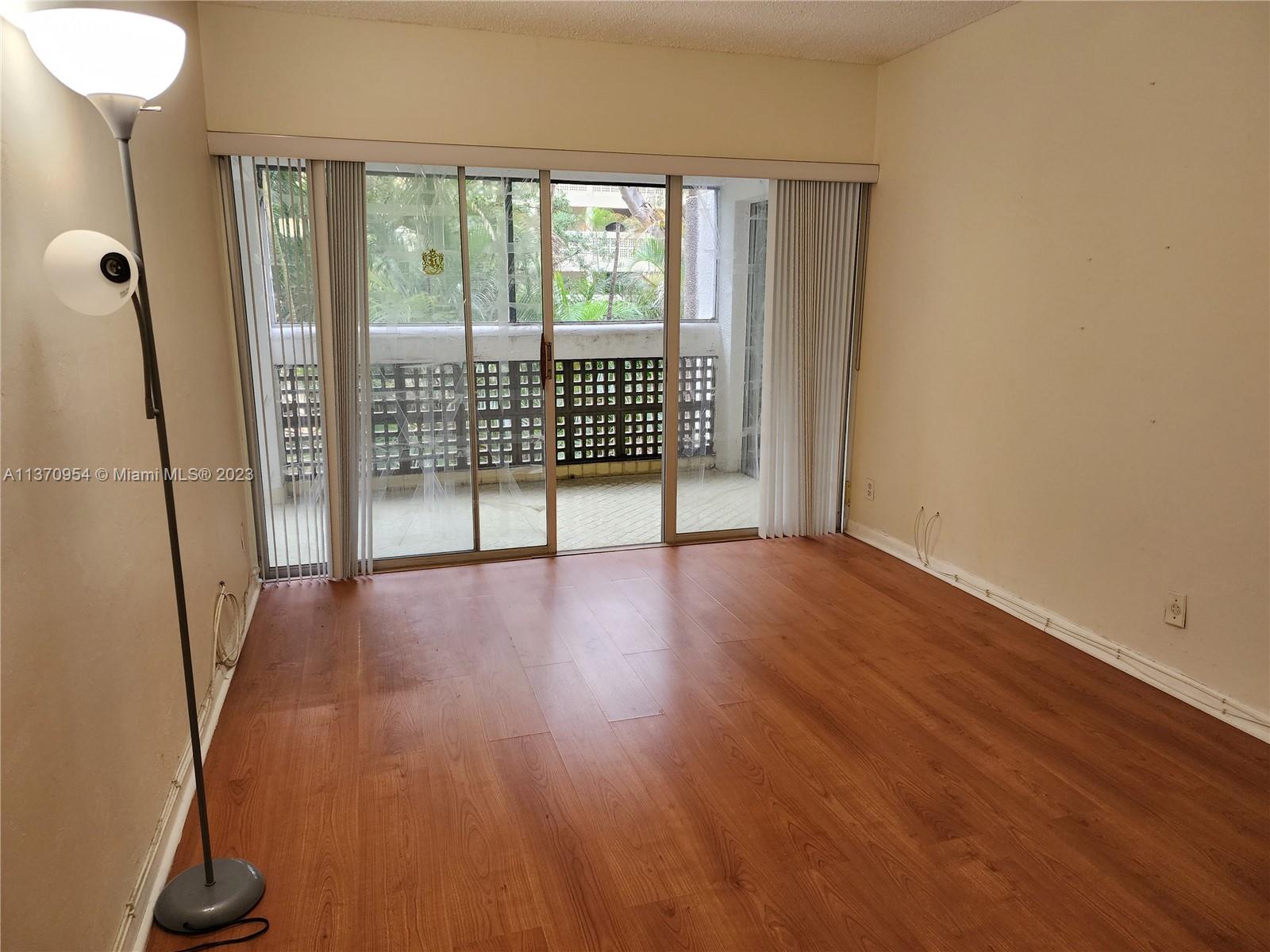 Inverrary Lauderhill, FL 33319 - Photo 1 of 11 wooden floor in an empty room with a window