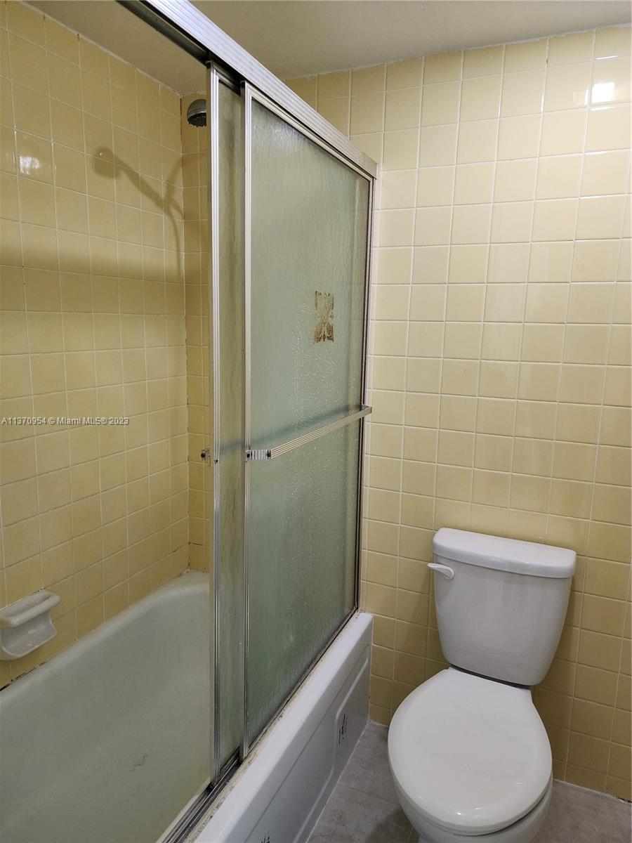 Inverrary Lauderhill, FL 33319 - Photo 6 of 11 a bathroom with a toilet and shower