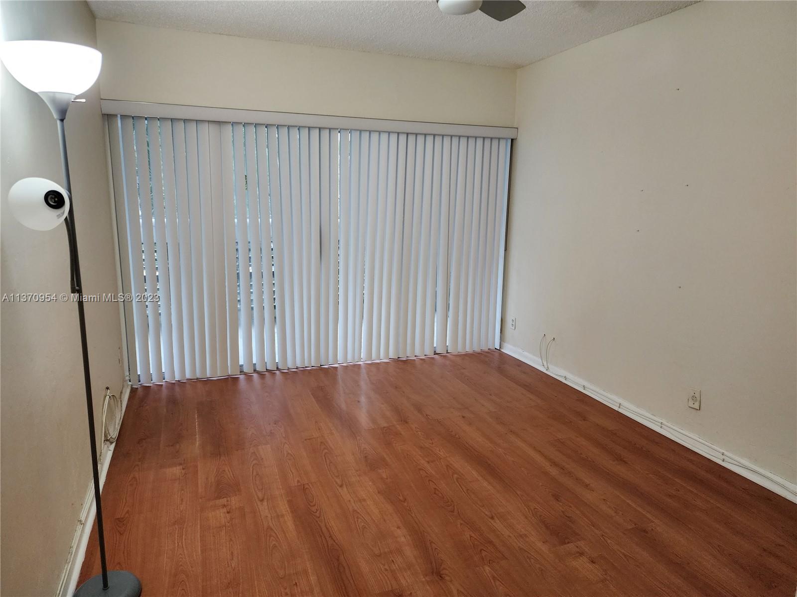 Inverrary Lauderhill, FL 33319 - Photo 7 of 11 a view of an empty room with wooden floor