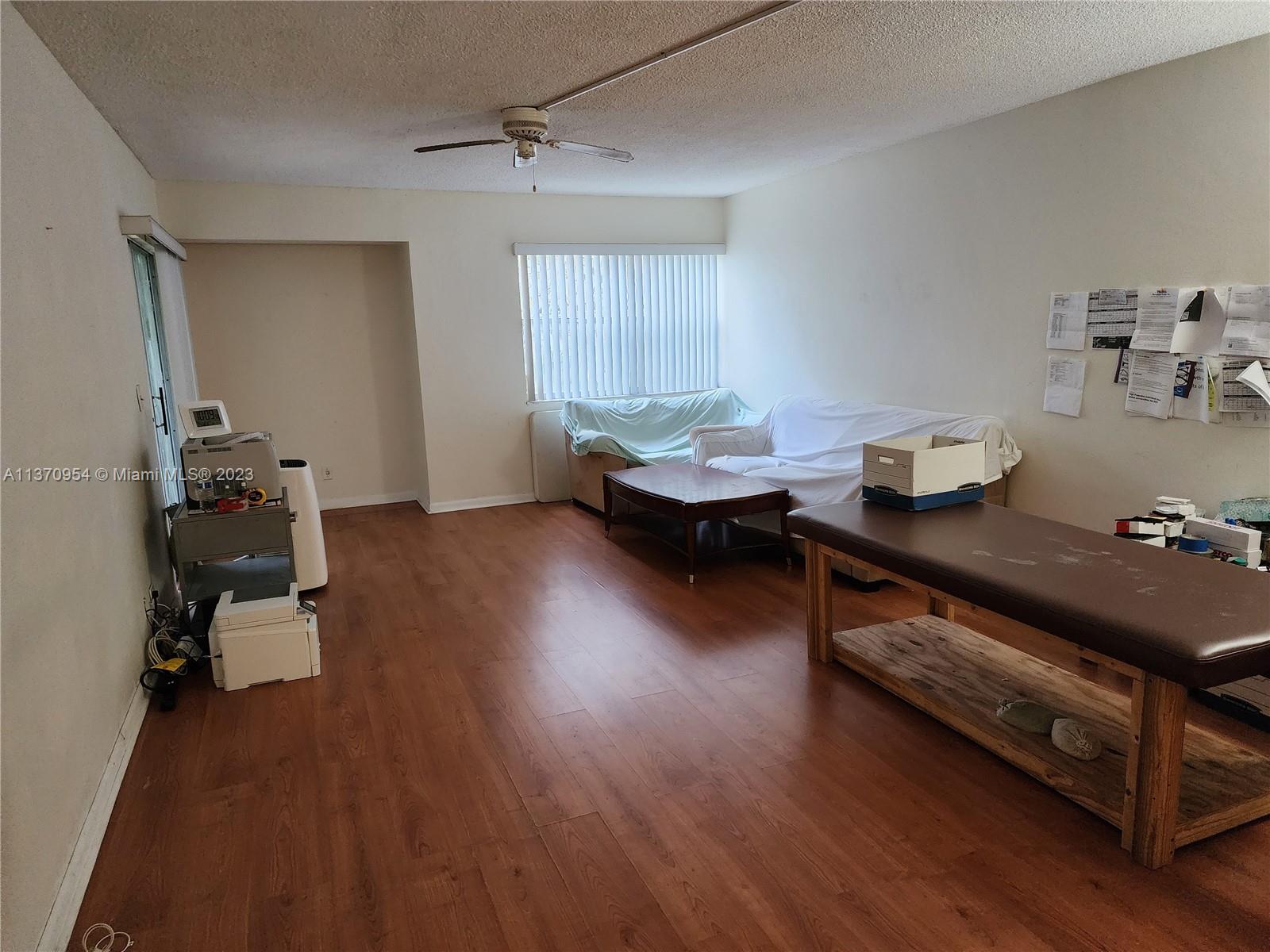 Inverrary Lauderhill, FL 33319 - Photo 8 of 11 a room with wooden floor and furniture