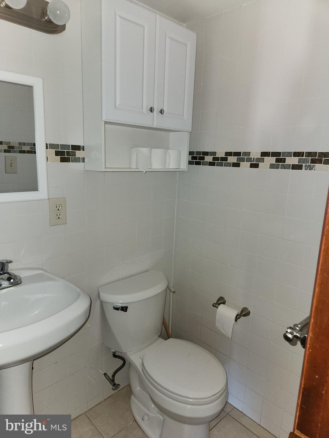 746 South Street Philadelphia, PA 19147 - Photo 11 of 18 a white toilet sitting next to a bathroom sink