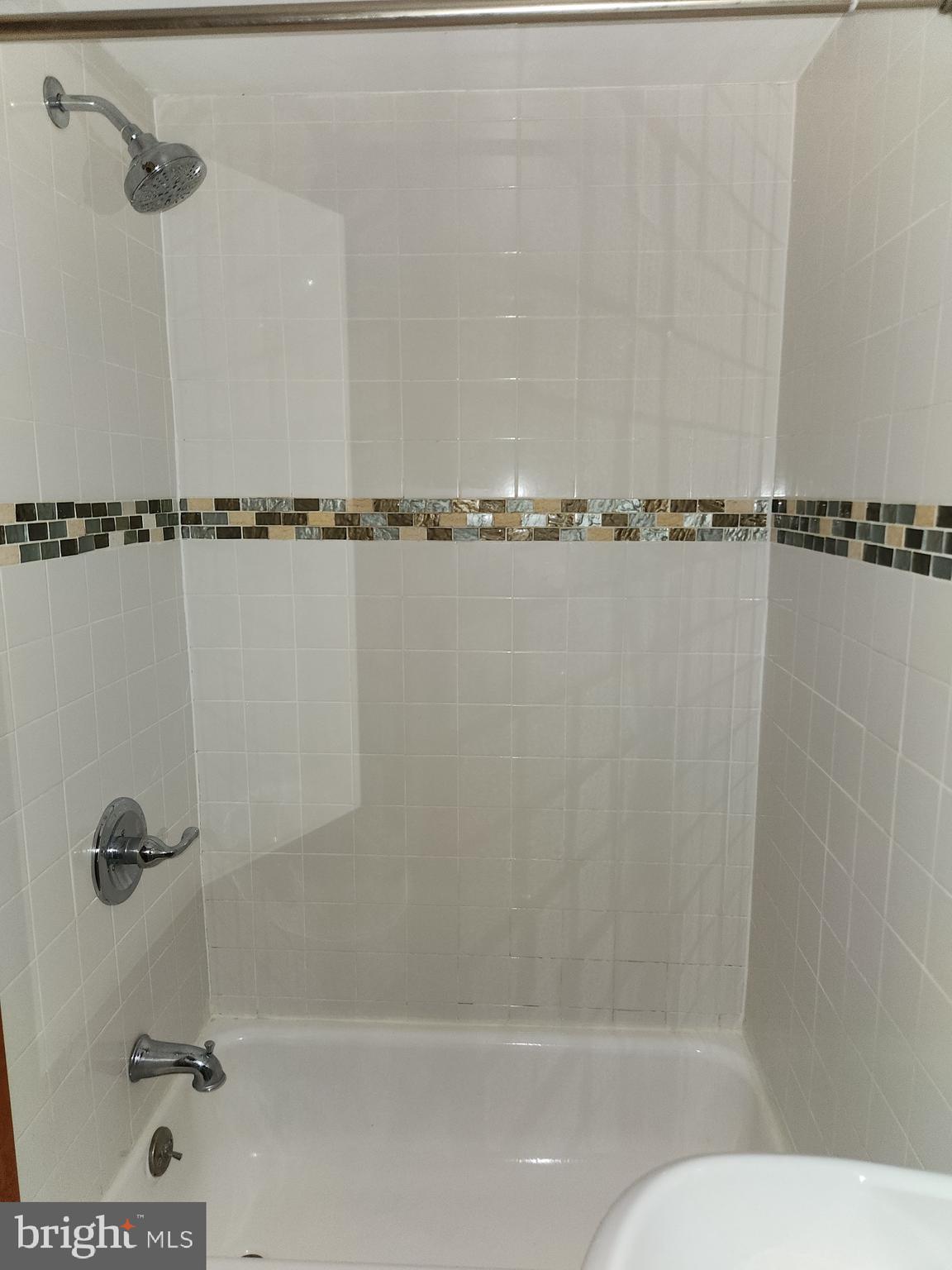 746 South Street Philadelphia, PA 19147 - Photo 12 of 18 a bathroom with a shower and a bathtub