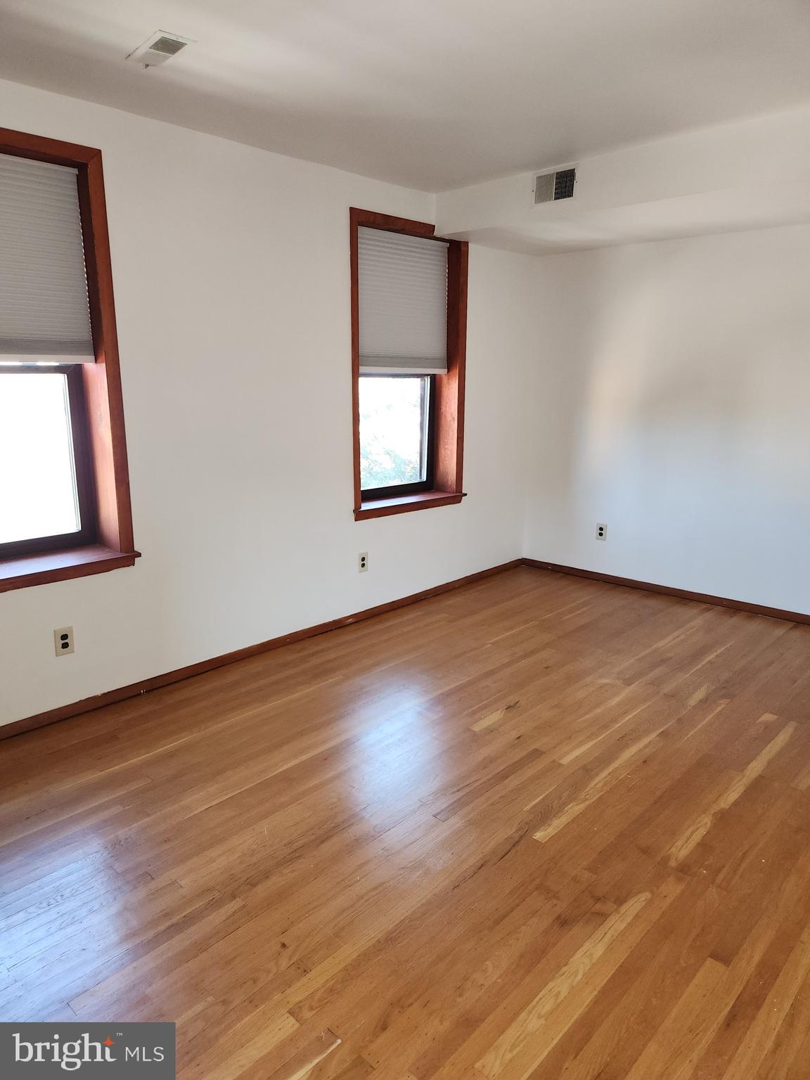 746 South Street Philadelphia, PA 19147 - Photo 16 of 18 a view of an empty room with wooden floor and a window
