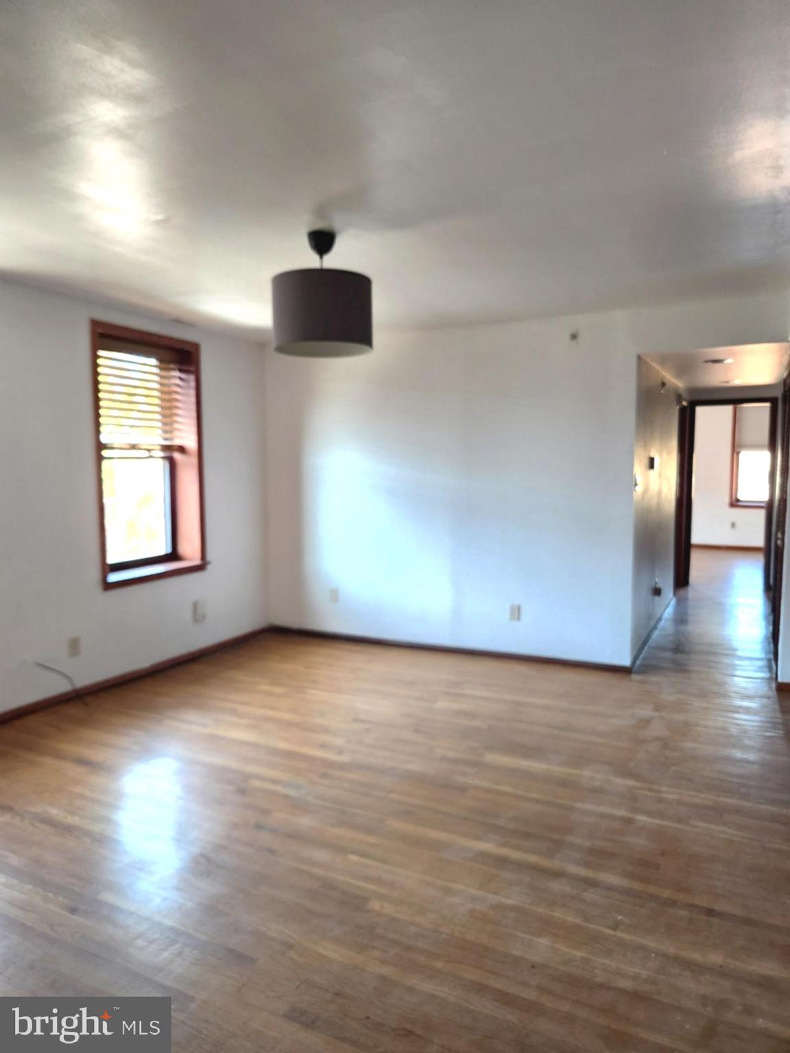 746 South Street Philadelphia, PA 19147 - Photo 4 of 18 an empty room with wooden floor and windows