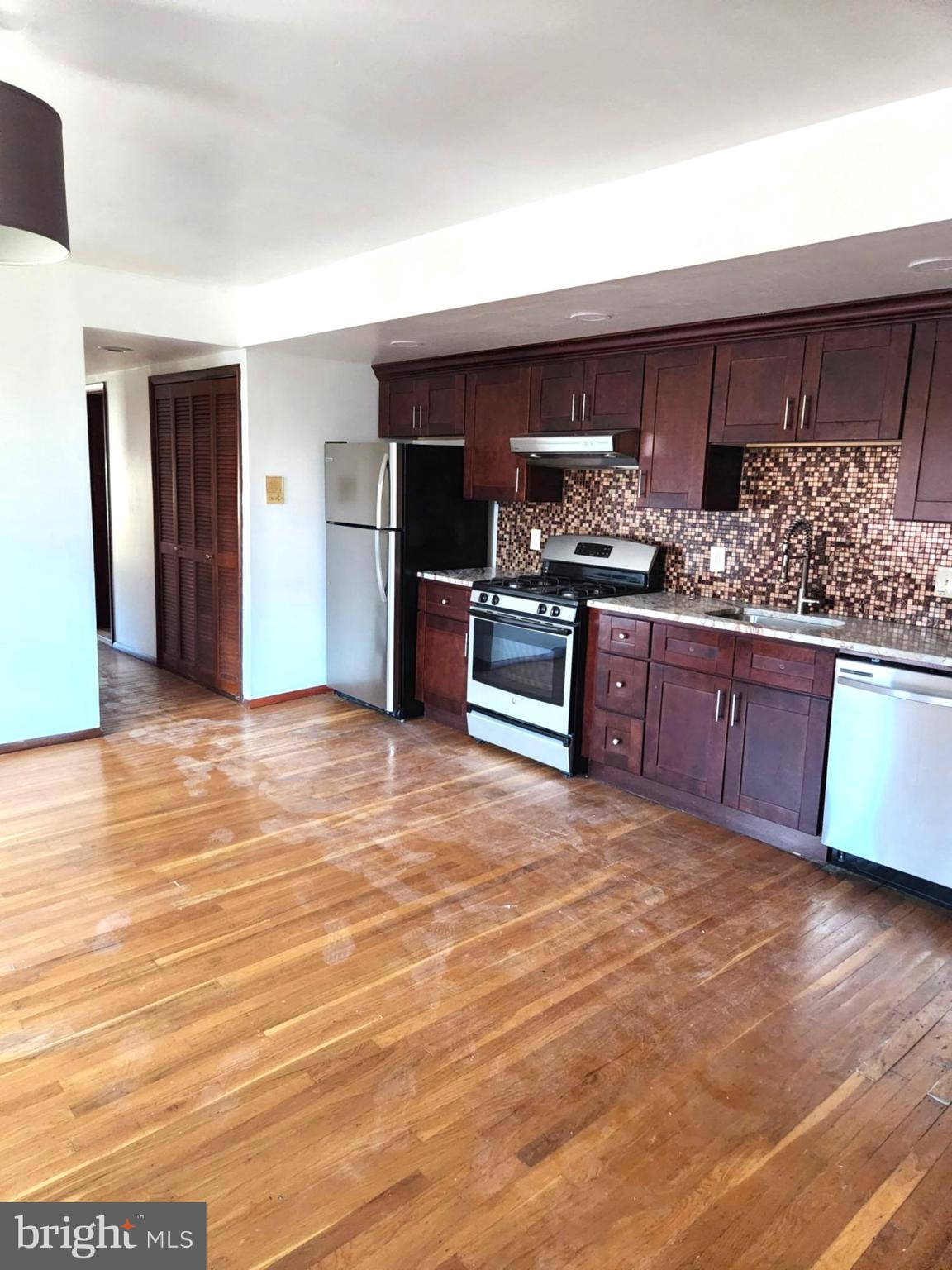 746 South Street Philadelphia, PA 19147 - Photo 5 of 18 a kitchen with stainless steel appliances granite countertop a sink and cabinets