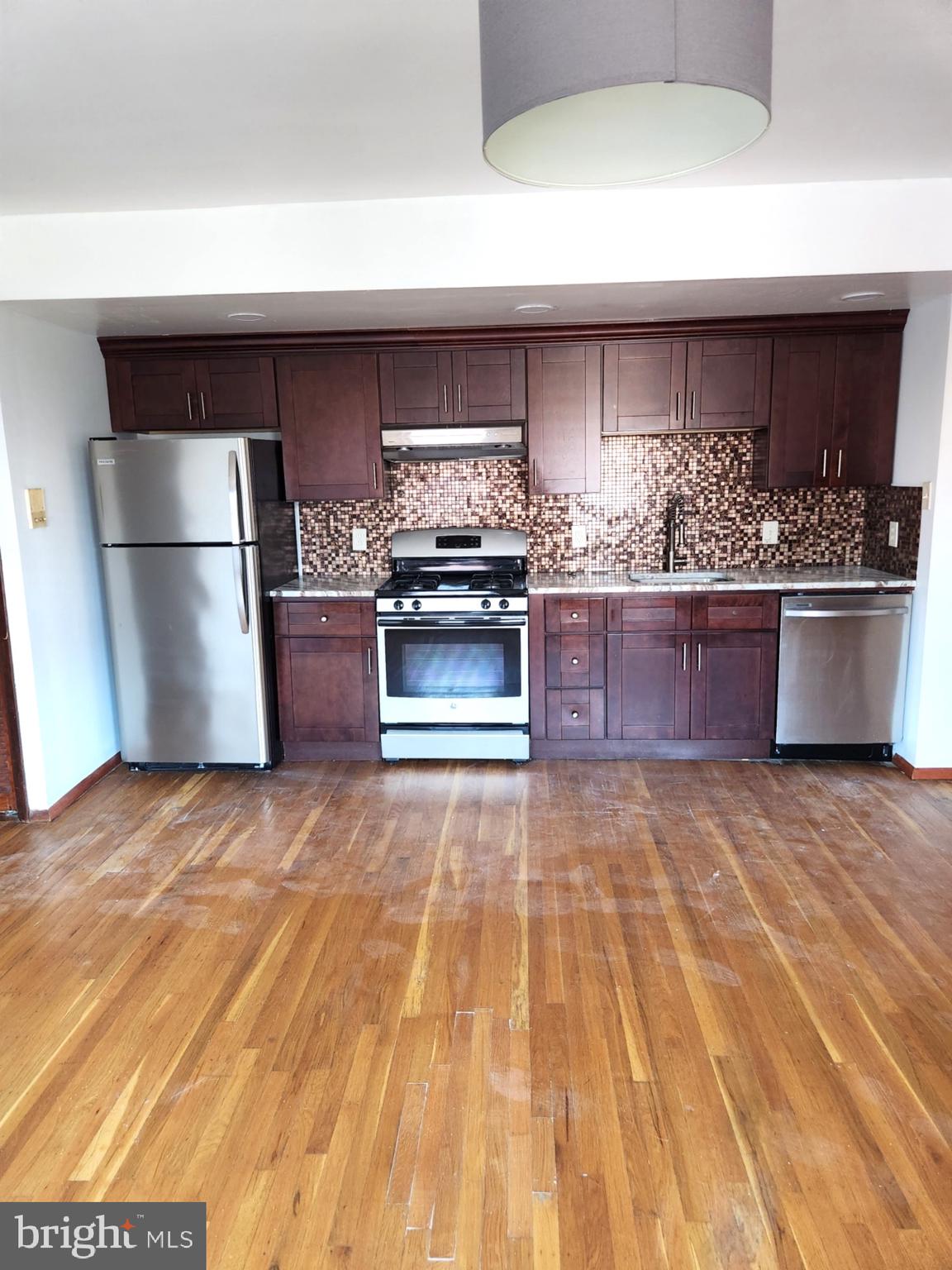 746 South Street Philadelphia, PA 19147 - Photo 7 of 18 a kitchen with stainless steel appliances granite countertop a sink stove and refrigerator