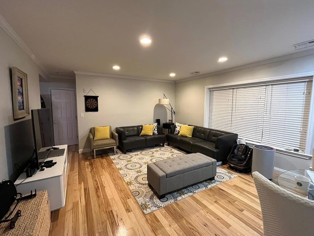 152 Newton Street, Unit 6 Boston, MA 02135 - Photo 1 of 17 a living room with furniture