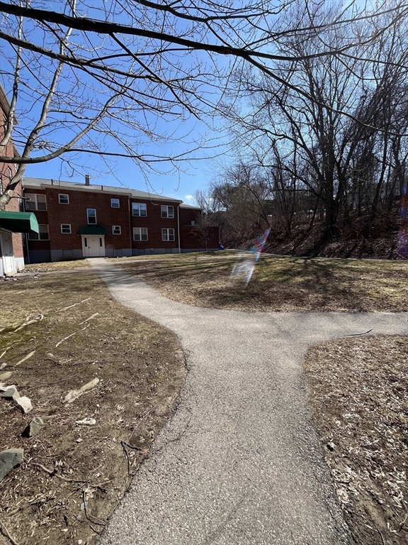 152 Newton Street, Unit 6 Boston, MA 02135 - Photo 16 of 17 a view of a yard with a car