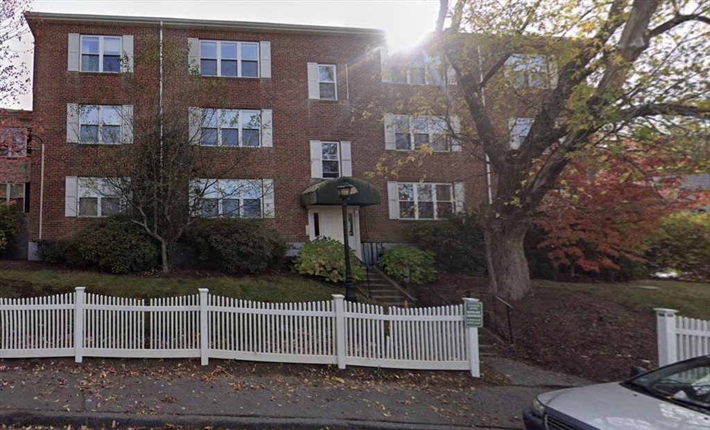 152 Newton Street, Unit 6 Boston, MA 02135 - Photo 17 of 17 a front view of a house with a garden