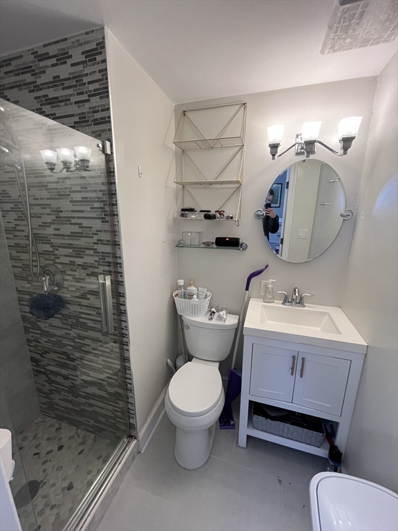 152 Newton Street, Unit 6 Boston, MA 02135 - Photo 3 of 17 a bathroom with a toilet and a shower
