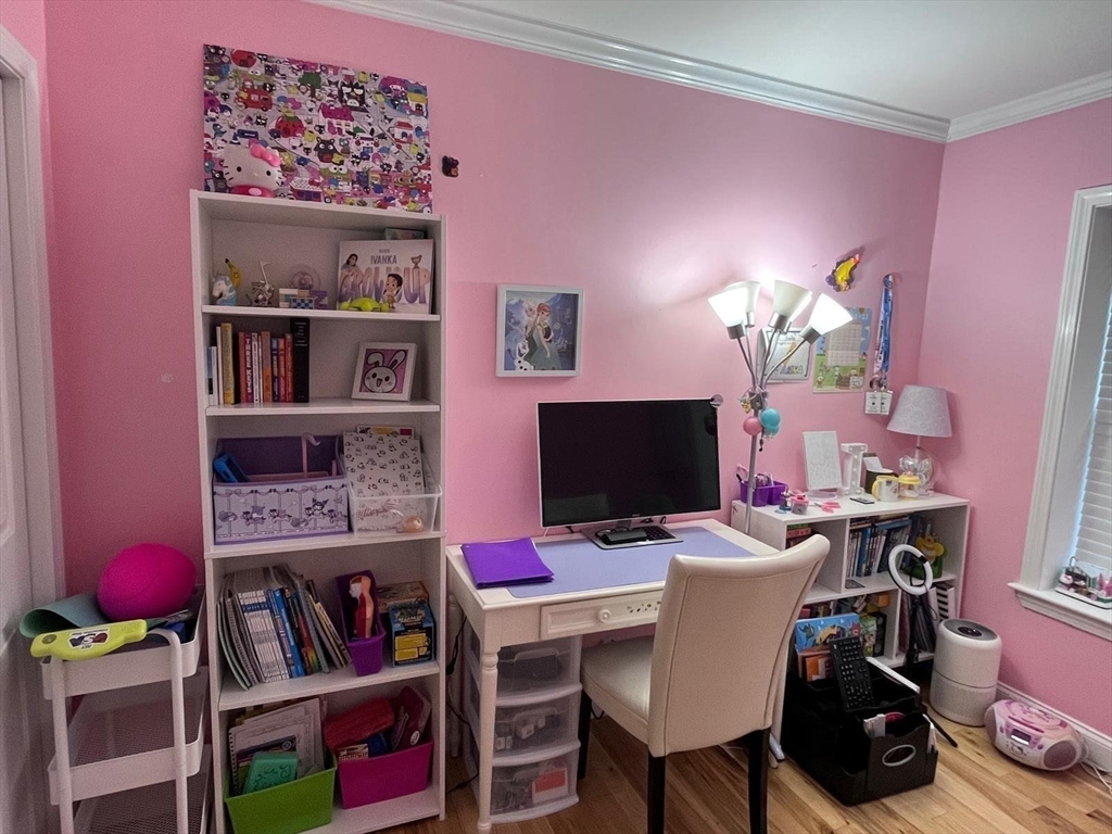 152 Newton Street, Unit 6 Boston, MA 02135 - Photo 5 of 17 a view of a workspace with furniture and a window