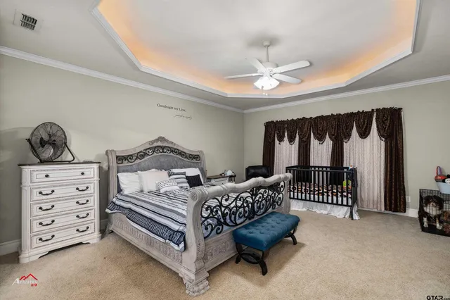a bedroom with furniture and a chandelier